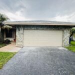 Solid (No glass) / 2-car garage doors Clopay Classic Steel Value Series Model 94 Desert Tan