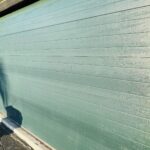 Solid (No glass) / 2-car garage doors Clopay Modern Steel Premium Series Model 4305 Hunter Green Modern Grooved Design