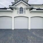 Solid (no glass) / 1-car garage doors Clopay Modern Steel Premium Series Model 4302 Black Modern Flush Design