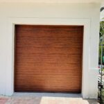 Solid (no glass) / 1-car garage doors Clopay Modern Steel Premium Series - Model 4305 - Ultra-Grain Cypress Walnut - Modern Grooved Design