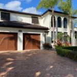 Solid (no glass) / 1-car garage doors Clopay Canyon Ridge Carriage House 5-Layer Design 22 - Cypress Walnut