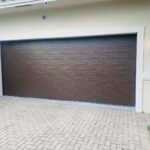 Solid (No glass) / 2-car garage doors Clopay Modern Steel Premium Series Model 4302 Chocolate Modern Flush Design