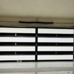 Full-view - (all glass) 2-car garage doors Full-view - Black Frame - Grey glass w/ Privacy - Interior view