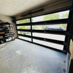 Full-view - (all glass) 2-car garage doors Full-view - Black Frame - Grey glass w/ No Privacy - Interior view