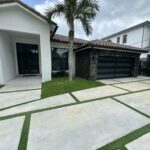 Full-view - (all glass) 2-car garage doors Full-view - Bronze frame - Grey glass w/ privacy