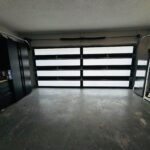 Full-view - (all glass) 2-car garage doors Full-view - Bronze frame - Grey glass w/ privacy - Interior view