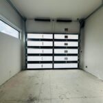 Full-view - (all glass) 2-car garage doors Eco Window Systems - Bronze frame - Bronze glass w/ privacy - Interior view