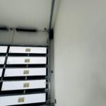 Full-view - (all glass) 2-car garage doors Eco Window Systems - Bronze frame - Bronze glass w/ privacy - Interior view