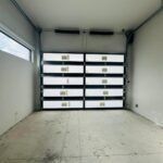 Full-view - (all glass) 2-car garage doors Eco Window Systems - Bronze frame - Bronze glass w/ privacy - Interior view