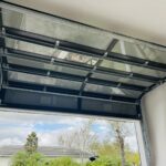 Full-view - (all glass) 2-car garage doors Eco Window Systems - Bronze frame - Bronze glass w/ privacy - Interior view