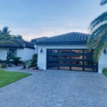 Full-view - (all glass) 2-car garage doors Clopay Modern Steel™ with Contemporary Windows - Premium Series with Intellicore® - Full-view - Mocha Brown - 1/4 Impact resistant Lexan glass