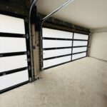 Full-view - (all glass) 2-car garage doors Full-view - Black Frame - Grey glass w/ Privacy - Interior view