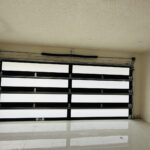 Full-view - (all glass) 2-car garage doors Full-view - Black Frame - Grey glass w/ Privacy - Interior view