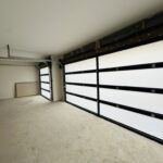 Full-view - (all glass) 2-car garage doors Full-view - Black Frame - Grey glass w/ Privacy - Interior view